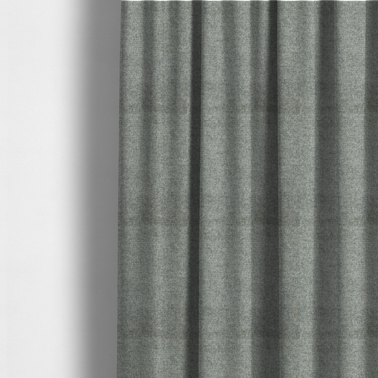 The fabric used to create these made-to-measure curtains is a fine, woven upholstery fabric in a cool, sophisticated slate grey tone, featuring a consistent and textured surface pattern.