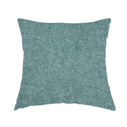 The fabric used to create this handmade cushion is a fine, woven upholstery fabric in a rich, calming teal or muted blue-green tone, featuring a consistent and textured surface pattern.