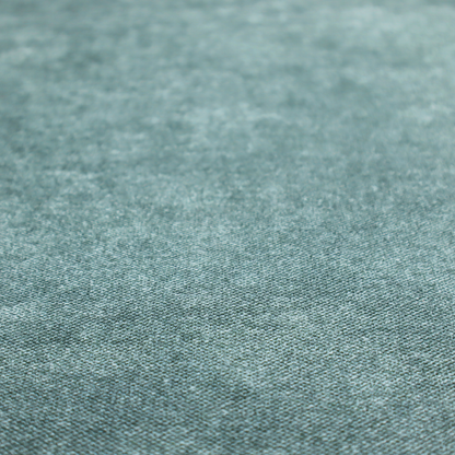 A fine, woven upholstery fabric in a rich, calming teal or muted blue-green tone, featuring a consistent and textured surface pattern.