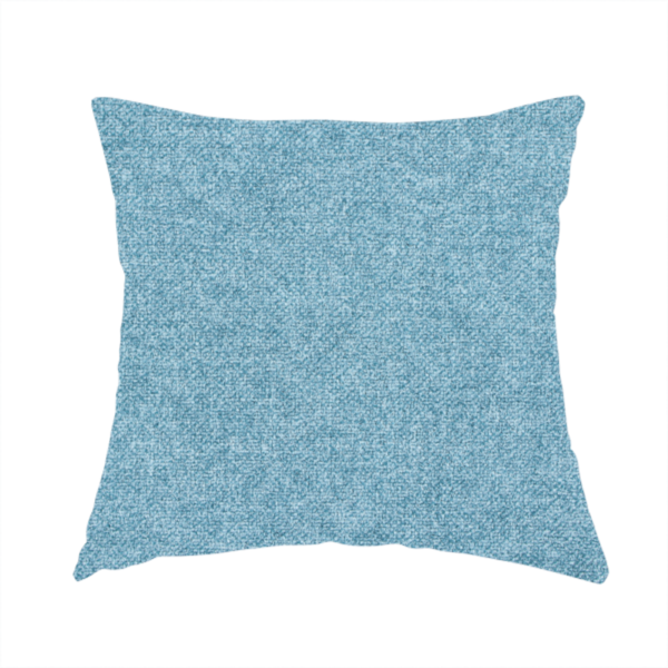 The fabric used to create this handmade cushion is a fine, woven upholstery fabric in a bright, refreshing sky blue tone, featuring a consistent and textured surface pattern.