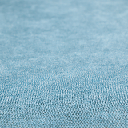 A fine, woven upholstery fabric in a bright, refreshing sky blue tone, featuring a consistent and textured surface pattern.
