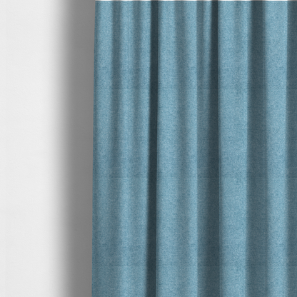 The fabric used to create these made-to-measure curtains is a fine, woven upholstery fabric in a bright, refreshing sky blue tone, featuring a consistent and textured surface pattern.