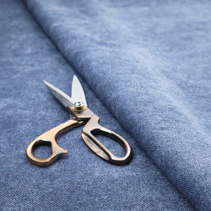 A fine, woven upholstery fabric in a deep, classic navy blue tone, featuring a consistent and textured surface pattern.