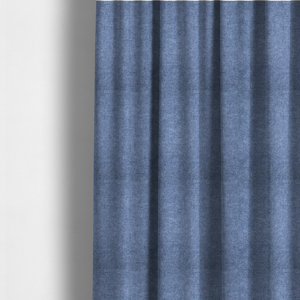 The fabric used to create these made-to-measure curtains is a fine, woven upholstery fabric in a deep, classic navy blue tone, featuring a consistent and textured surface pattern.