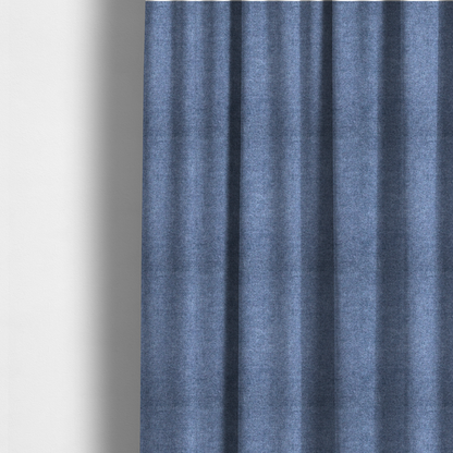 The fabric used to create these made-to-measure curtains is a fine, woven upholstery fabric in a deep, classic navy blue tone, featuring a consistent and textured surface pattern.