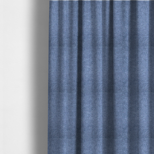 The fabric used to create these made-to-measure curtains is a fine, woven upholstery fabric in a deep, classic navy blue tone, featuring a consistent and textured surface pattern.