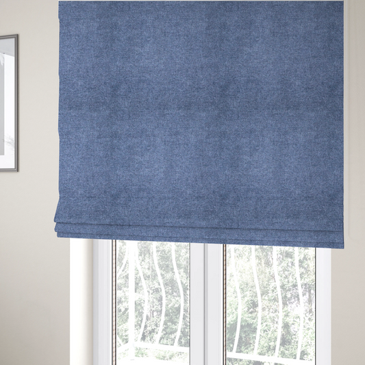 The fabric used to create these Roman blinds is a fine, woven upholstery fabric in a deep, classic navy blue tone, featuring a consistent and textured surface pattern.