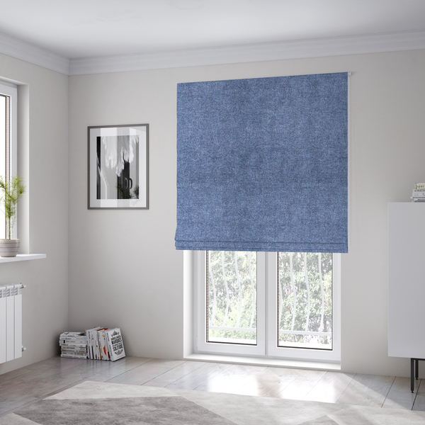 The fabric used to create these Roman blinds is a fine, woven upholstery fabric in a deep, classic navy blue tone, featuring a consistent and textured surface pattern.