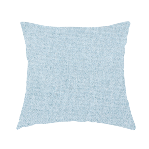 The fabric used to create this handmade cushion is a fine, woven upholstery fabric in a soft, airy, powder blue tone, featuring a consistent and textured surface pattern.