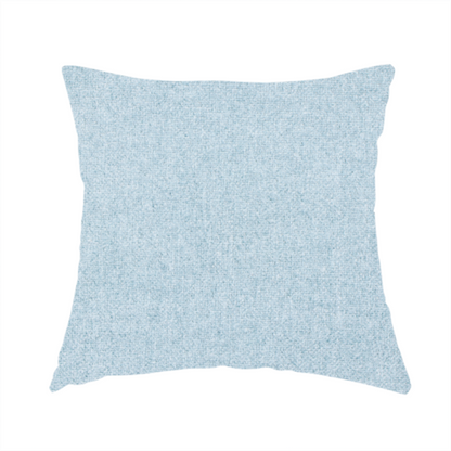 The fabric used to create this handmade cushion is a fine, woven upholstery fabric in a soft, airy, powder blue tone, featuring a consistent and textured surface pattern.