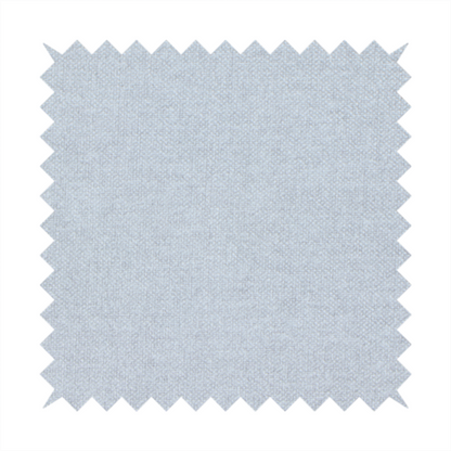 A fine, woven upholstery fabric in a subtle, cool-toned pale grey or off-white, featuring a consistent and textured surface pattern.