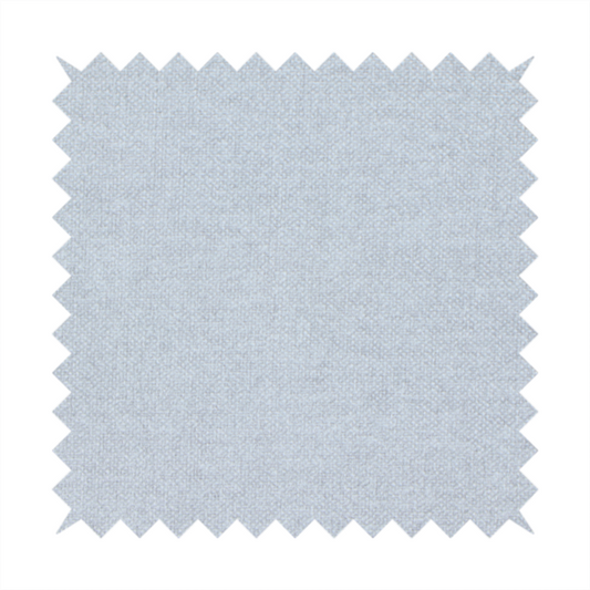 A fine, woven upholstery fabric in a subtle, cool-toned pale grey or off-white, featuring a consistent and textured surface pattern.