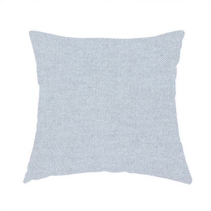 The fabric used to create this handmade cushion is a fine, woven upholstery fabric in a subtle, cool-toned pale grey or off-white, featuring a consistent and textured surface pattern.