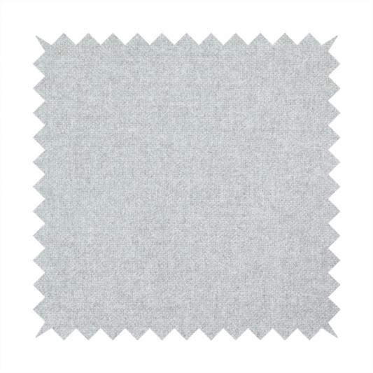 A fine, woven upholstery fabric in a clean, neutral light grey or soft silver tone, featuring a consistent and textured surface pattern.