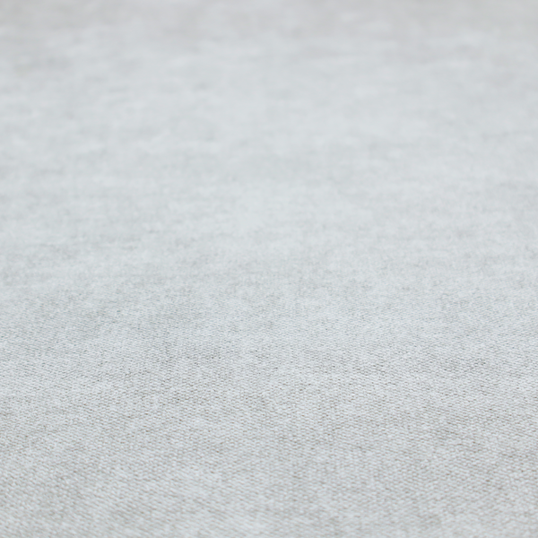 A fine, woven upholstery fabric in a clean, neutral light grey or soft silver tone, featuring a consistent and textured surface pattern.