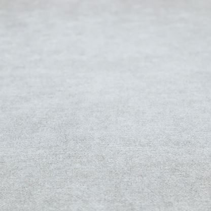 A fine, woven upholstery fabric in a clean, neutral light grey or soft silver tone, featuring a consistent and textured surface pattern.