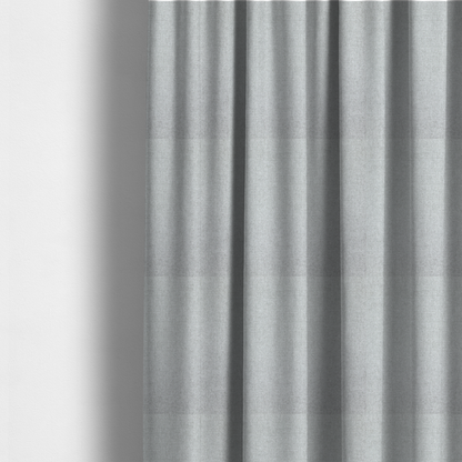 the fabric used to create these made-to-measure curtains is a fine, woven upholstery fabric in a clean, neutral light grey or soft silver tone, featuring a consistent and textured surface pattern.