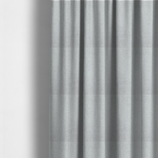 the fabric used to create these made-to-measure curtains is a fine, woven upholstery fabric in a clean, neutral light grey or soft silver tone, featuring a consistent and textured surface pattern.