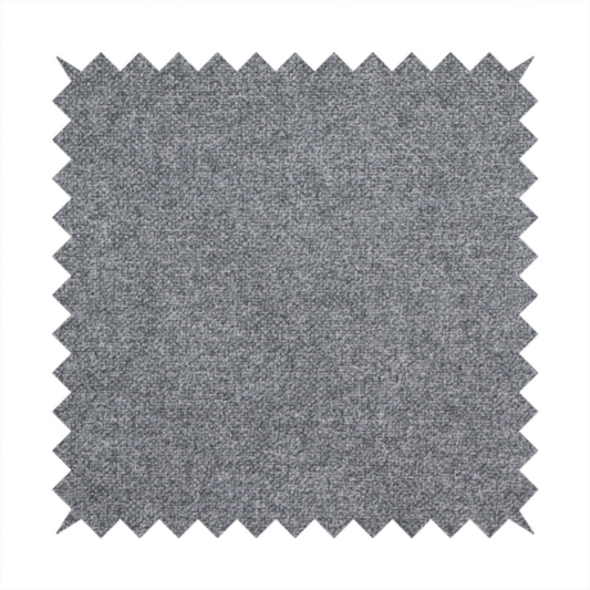 A fine, woven upholstery fabric in a deep, moody charcoal grey tone, featuring a consistent and textured surface pattern.