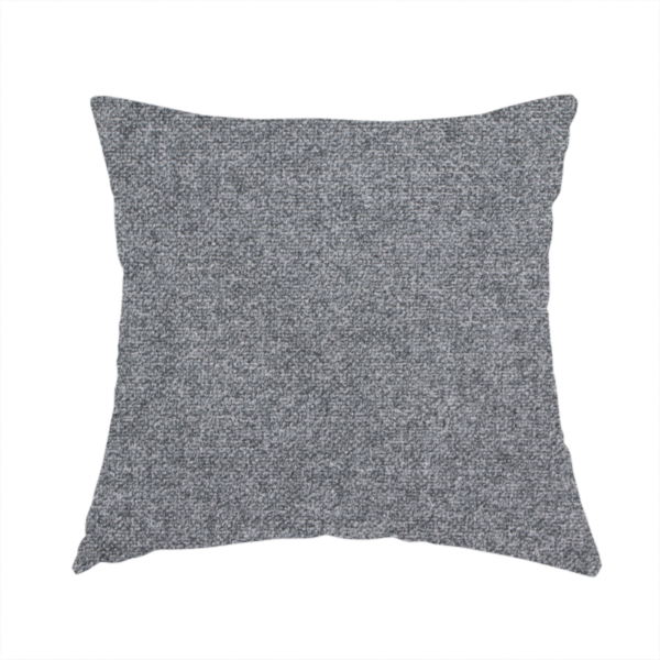 The fabric used to create this handmade cushion is a fine, woven upholstery fabric in a deep, moody charcoal grey tone, featuring a consistent and textured surface pattern.