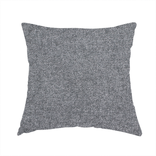 The fabric used to create this handmade cushion is a fine, woven upholstery fabric in a deep, moody charcoal grey tone, featuring a consistent and textured surface pattern.