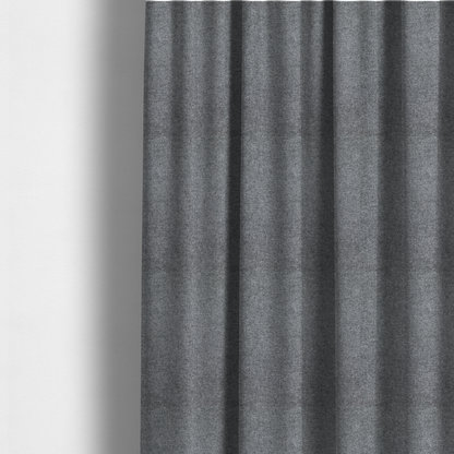 The fabric used to create these made-to-measure curtains is a fine, woven upholstery fabric in a deep, moody charcoal grey tone, featuring a consistent and textured surface pattern.