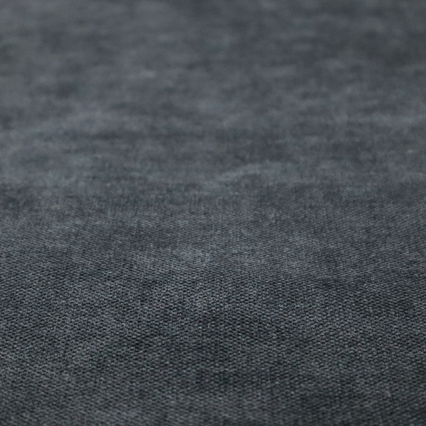 A fine, woven upholstery fabric in a dark, sophisticated slate grey or near-black tone, featuring a consistent and textured surface pattern.