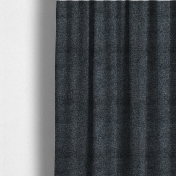 The fabric used to create these made-to-measure curtains is a fine, woven upholstery fabric in a dark, sophisticated slate grey or near-black tone, featuring a consistent and textured surface pattern.