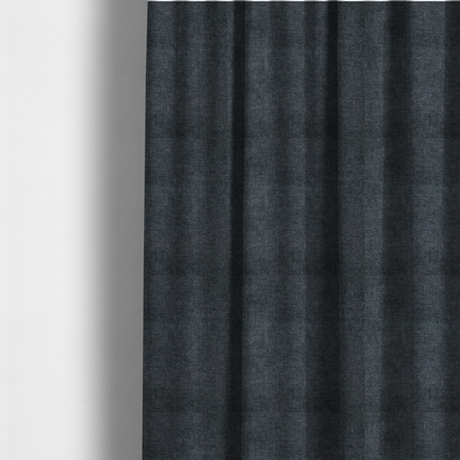 The fabric used to create these made-to-measure curtains is a fine, woven upholstery fabric in a dark, sophisticated slate grey or near-black tone, featuring a consistent and textured surface pattern.