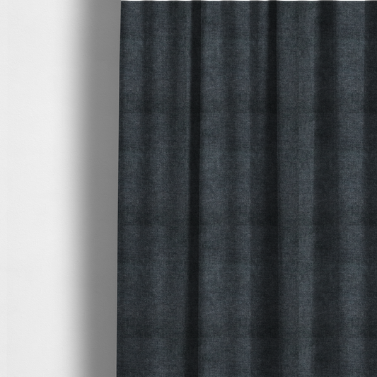 The fabric used to create these made-to-measure curtains is a fine, woven upholstery fabric in a dark, sophisticated slate grey or near-black tone, featuring a consistent and textured surface pattern.