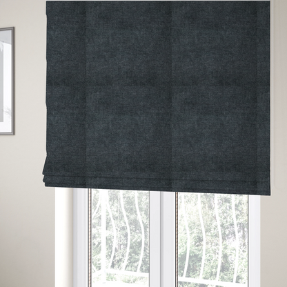 The fabric used to create these Roman blinds is a fine, woven upholstery fabric in a dark, sophisticated slate grey or near-black tone, featuring a consistent and textured surface pattern.