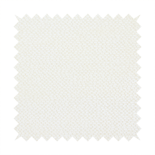This image shows a close-up, high-resolution texture of a cream or off-white fabric. The material features a dense, uniform, boucle-style weave, characterized by small, looped, and nubby yarn fibres that create a soft, textured surface appearance.