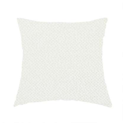 The fabric used to create this handmade cushion is a cream or off-white fabric. The material features a dense, uniform, boucle-style weave, characterized by small, looped, and nubby yarn fibres that create a soft, textured surface appearance.