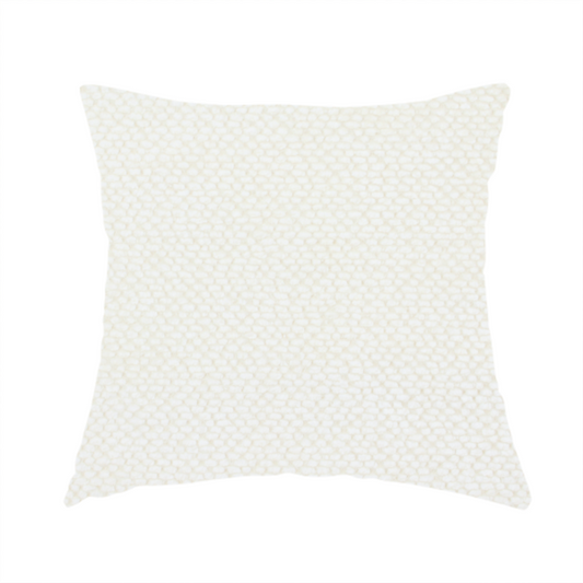 The fabric used to create this handmade cushion is a cream or off-white fabric. The material features a dense, uniform, boucle-style weave, characterized by small, looped, and nubby yarn fibres that create a soft, textured surface appearance.