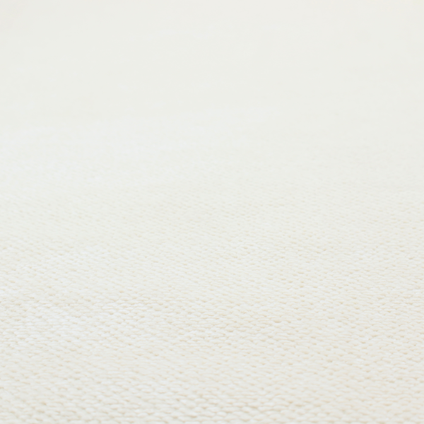 This image shows a close-up, high-resolution texture of a cream or off-white fabric. The material features a dense, uniform, boucle-style weave, characterized by small, looped, and nubby yarn fibres that create a soft, textured surface appearance.