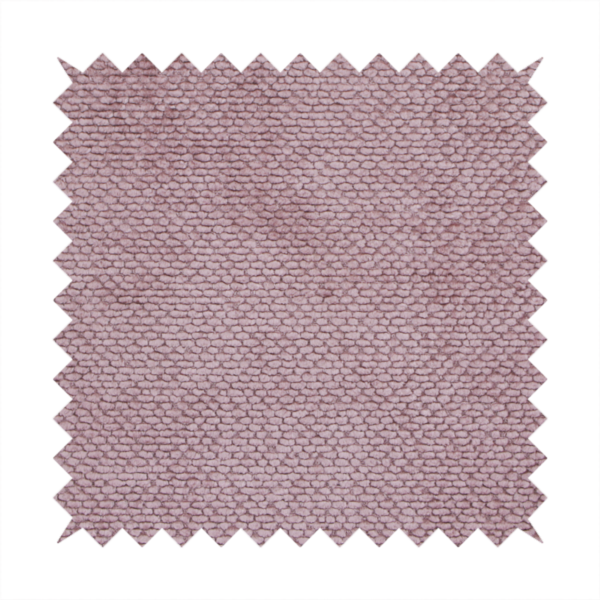 A muted, dusty rose or soft mauve upholstery fabric. It maintains the signature dense, uniform, boucle-style weave seen in the previous samples, featuring small, looped, and nubby yarn fibres that create a soft and tactile surface.