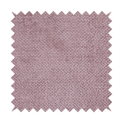 A muted, dusty rose or soft mauve upholstery fabric. It maintains the signature dense, uniform, boucle-style weave seen in the previous samples, featuring small, looped, and nubby yarn fibres that create a soft and tactile surface.