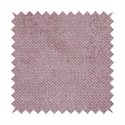 A muted, dusty rose or soft mauve upholstery fabric. It maintains the signature dense, uniform, boucle-style weave seen in the previous samples, featuring small, looped, and nubby yarn fibres that create a soft and tactile surface.
