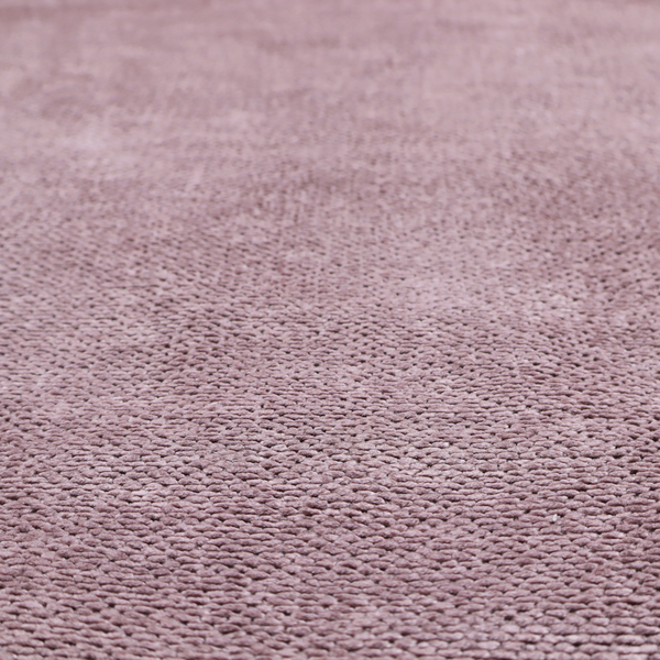 A muted, dusty rose or soft mauve upholstery fabric. It maintains the signature dense, uniform, boucle-style weave seen in the previous samples, featuring small, looped, and nubby yarn fibres that create a soft and tactile surface.
