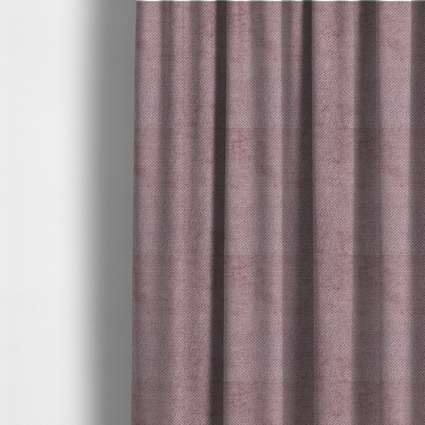 The fabric used to create these made-to-measure curtains is a muted, dusty rose or soft mauve upholstery fabric. It maintains the signature dense, uniform, boucle-style weave seen in the previous samples, featuring small, looped, and nubby yarn fibres that create a soft and tactile surface.