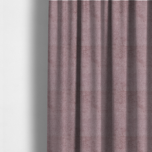 The fabric used to create these made-to-measure curtains is a muted, dusty rose or soft mauve upholstery fabric. It maintains the signature dense, uniform, boucle-style weave seen in the previous samples, featuring small, looped, and nubby yarn fibres that create a soft and tactile surface.