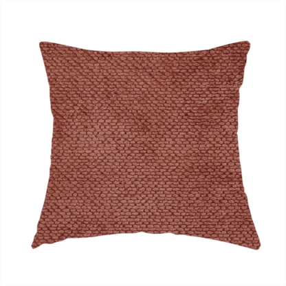 The fabric used to create this handmade cushion is a rich, terracotta or rust-toned upholstery fabric. It maintains the signature dense, uniform, boucle-style weave featured in the collection, composed of small, looped, and nubby yarn fibres that provide a soft and tactile surface.