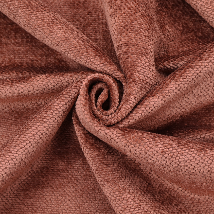 A rich, terracotta or rust-toned upholstery fabric. It maintains the signature dense, uniform, boucle-style weave featured in the collection, composed of small, looped, and nubby yarn fibres that provide a soft and tactile surface.