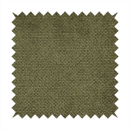 A deep, earth-toned olive green upholstery fabric. It continues the signature dense, uniform, boucle-style weave of the collection, created with small, looped, and nubby yarn fibres that offer a soft and tactile surface.