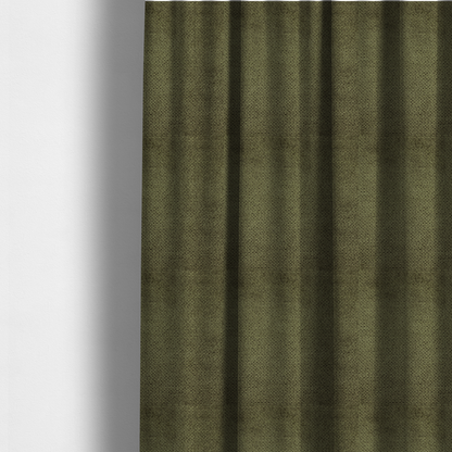 The fabric used to create these made-to-measure curtains is a deep, earth-toned olive green upholstery fabric. It continues the signature dense, uniform, boucle-style weave of the collection, created with small, looped, and nubby yarn fibres that offer a soft and tactile surface.