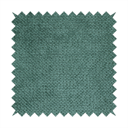A deep, rich teal or blue-green upholstery fabric. It maintains the signature dense, uniform, boucle-style weave of the collection, composed of small, looped, and nubby yarn fibres that create a soft and tactile surface.