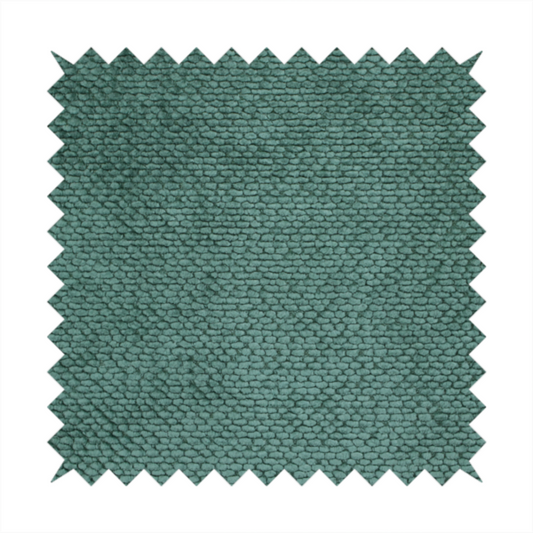 A deep, rich teal or blue-green upholstery fabric. It maintains the signature dense, uniform, boucle-style weave of the collection, composed of small, looped, and nubby yarn fibres that create a soft and tactile surface.