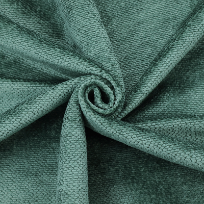 A deep, rich teal or blue-green upholstery fabric. It maintains the signature dense, uniform, boucle-style weave of the collection, composed of small, looped, and nubby yarn fibres that create a soft and tactile surface.