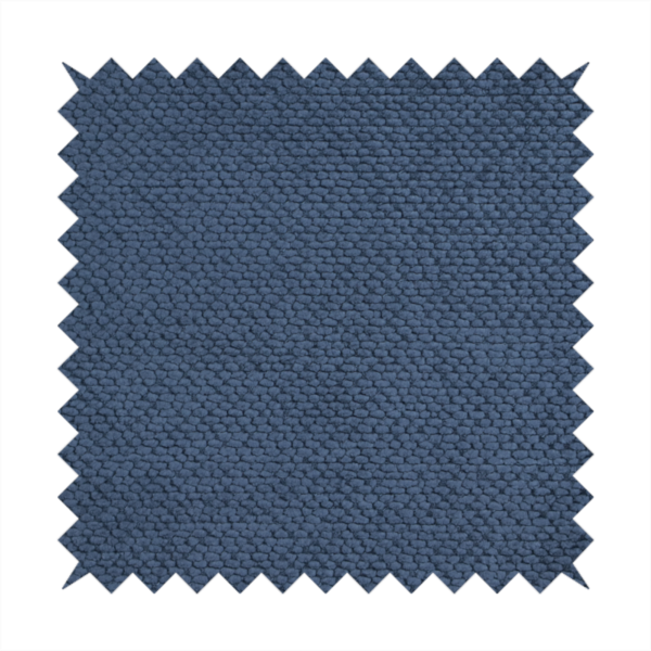 A deep, rich navy blue upholstery fabric. It features the signature dense, uniform, boucle-style weave of the collection, composed of small, looped, and nubby yarn fibres that create a soft and tactile surface.