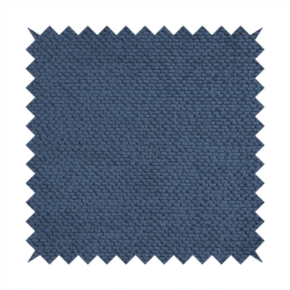 A deep, rich navy blue upholstery fabric. It features the signature dense, uniform, boucle-style weave of the collection, composed of small, looped, and nubby yarn fibres that create a soft and tactile surface.